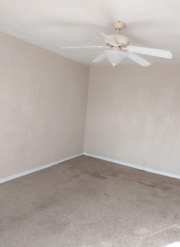 1311 Lamar Ave, Big Spring, TX 79720 - empty room featuring carpet floors, a ceiling fan, and baseboards