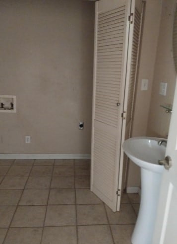 1311 Lamar Ave, Big Spring, TX 79720 - bathroom featuring tile patterned flooring and baseboards