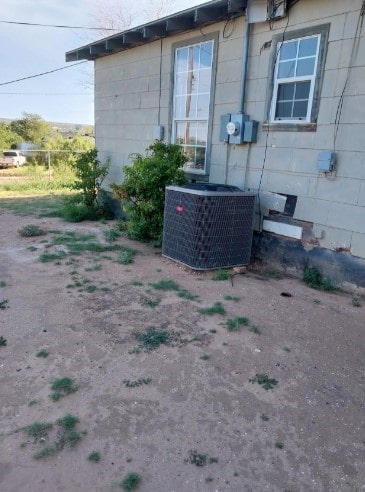 1311 Lamar Ave, Big Spring, TX 79720 - exterior view of central air condition unit and electric meter