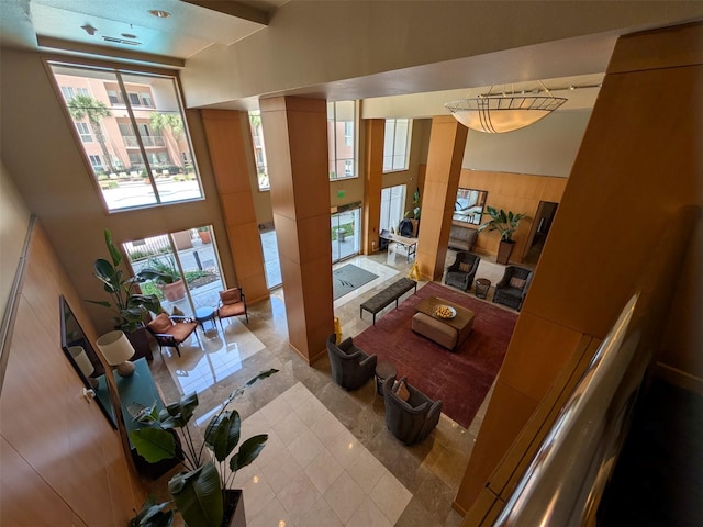 3505 Sage Rd Unit 1809, Houston, TX 77056 - tiled living area featuring a high ceiling and plenty of natural light