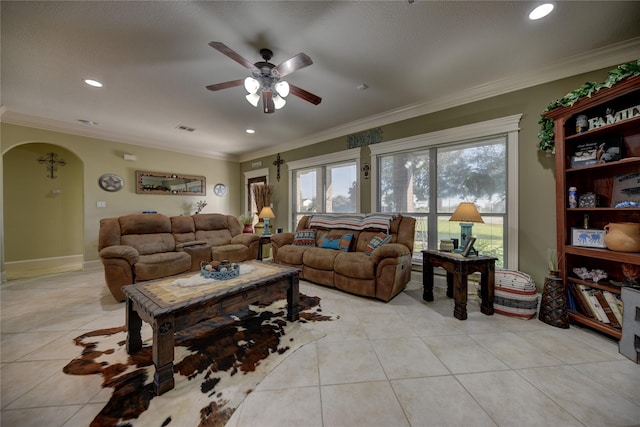 3077 Dees Cir, Sealy, TX 77474 - living area featuring light tile patterned floors, a ceiling fan, crown molding, arched walkways, and recessed lighting