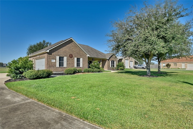 3077 Dees Cir, Sealy, TX 77474 - ranch-style house featuring brick siding, a front lawn, an attached garage, and concrete driveway