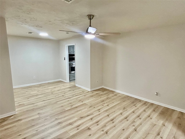 22906 Lemon Grove Dr, Spring, TX 77373 - empty room with light wood-type flooring and a ceiling fan