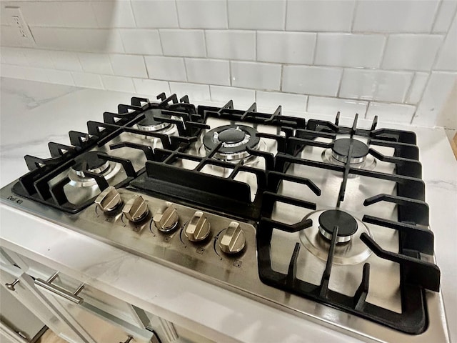 22906 Lemon Grove Dr, Spring, TX 77373 - kitchen view of stainless steel gas cooktop and backsplash