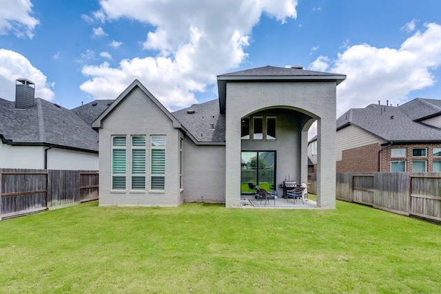 4222 Ana Ridge Ln, Fulshear, TX 77441 - back of house with brick siding, a patio area, and roof with shingles