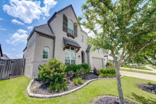 4222 Ana Ridge Ln, Fulshear, TX 77441 - view of front facade featuring brick siding, concrete driveway, and an attached garage