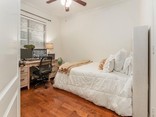 4133 Dickson St, Houston, TX 77007 - bedroom with wood finished floors, a desk, a ceiling fan, and crown molding