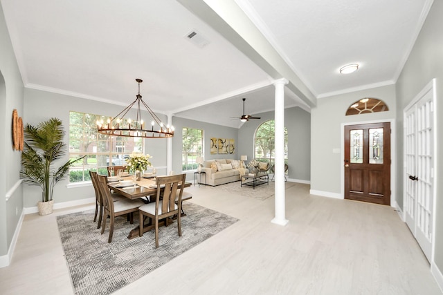 2019 Teakwood Pl, Sugar Land, TX 77478 - dining room featuring ornate columns, light wood-style floors, baseboards, a chandelier, and ornamental molding