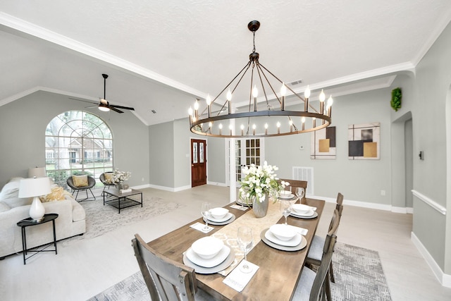 2019 Teakwood Pl, Sugar Land, TX 77478 - dining room with light wood-style floors, arched walkways, baseboards, a chandelier, and lofted ceiling