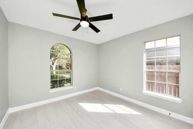 2019 Teakwood Pl, Sugar Land, TX 77478 - unfurnished room featuring light wood-type flooring, ceiling fan, and baseboards