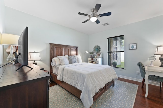 507 Carriage View Ln, Huffman, TX 77336 - bedroom with dark wood finished floors and ceiling fan