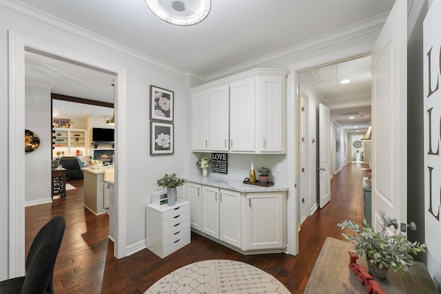 507 Carriage View Ln, Huffman, TX 77336 - corridor featuring attic access, dark wood finished floors, ornamental molding, and a desk