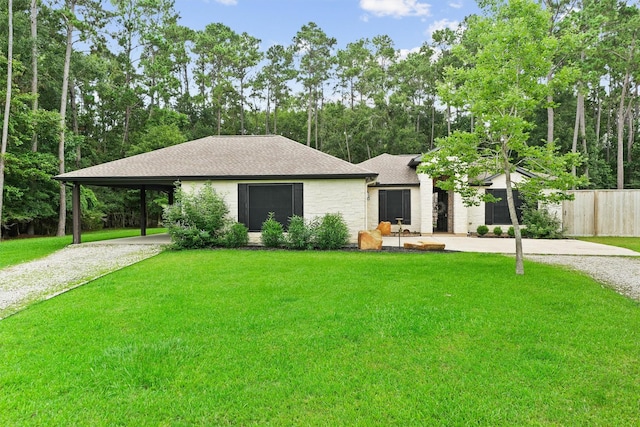 507 Carriage View Ln, Huffman, TX 77336 - view of front facade with driveway, an attached carport, and a shingled roof