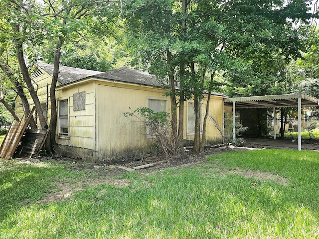4926 Idaho St, Houston, TX 77021 - view of property exterior with roof with shingles and a carport