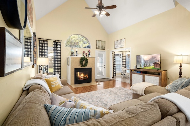 3233 Greenhead St, Katy, TX 77493 - living room featuring high vaulted ceiling, a fireplace, wood finished floors, and ceiling fan