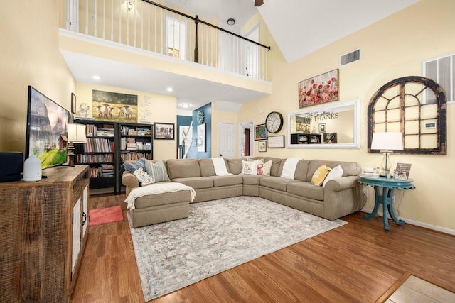 3233 Greenhead St, Katy, TX 77493 - living room with wood finished floors, high vaulted ceiling, and baseboards