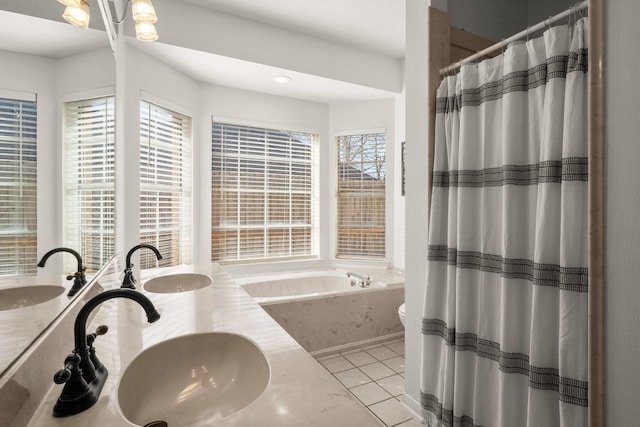 3233 Greenhead St, Katy, TX 77493 - bathroom featuring a bath, double vanity, tile patterned floors, a shower with shower curtain, and toilet