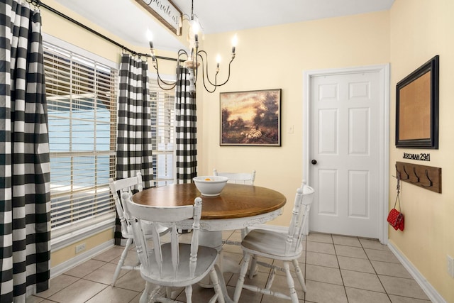3233 Greenhead St, Katy, TX 77493 - dining room featuring light tile patterned floors, baseboards, and a chandelier