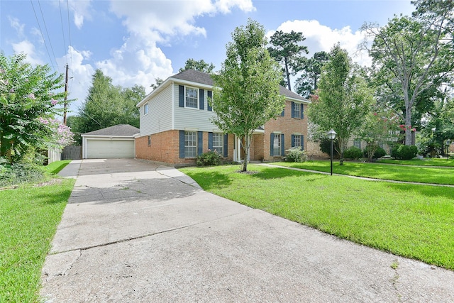 5411 Mossy Timbers Dr, Humble, TX 77346 - view of front of property featuring brick siding, a front yard, a garage, and an outbuilding