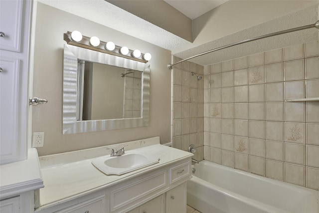 5411 Mossy Timbers Dr, Humble, TX 77346 - bathroom with bathing tub / shower combination, vanity, and a textured ceiling