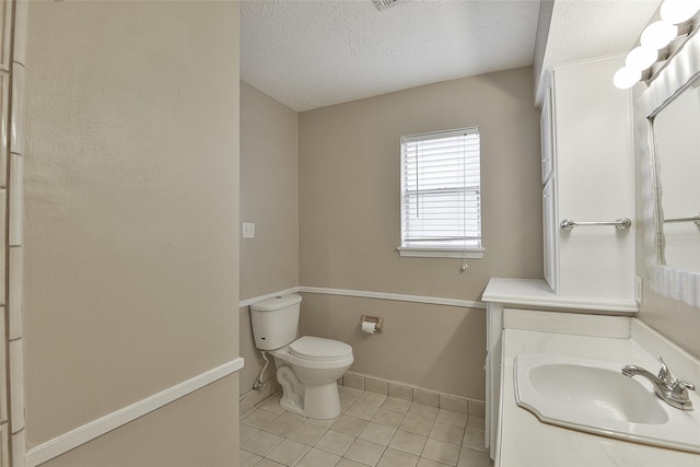 5411 Mossy Timbers Dr, Humble, TX 77346 - bathroom featuring tile patterned flooring, a textured ceiling, and vanity