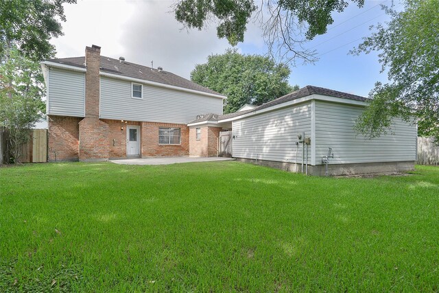5411 Mossy Timbers Dr, Humble, TX 77346 - rear view of property with a patio area, a chimney, and brick siding