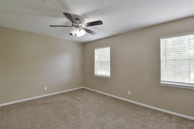 5411 Mossy Timbers Dr, Humble, TX 77346 - spare room with ceiling fan, carpet flooring, and a textured ceiling