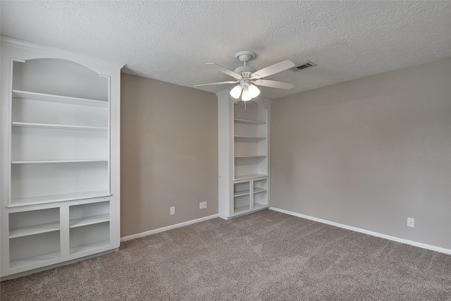 5411 Mossy Timbers Dr, Humble, TX 77346 - spare room with ceiling fan, carpet floors, and a textured ceiling