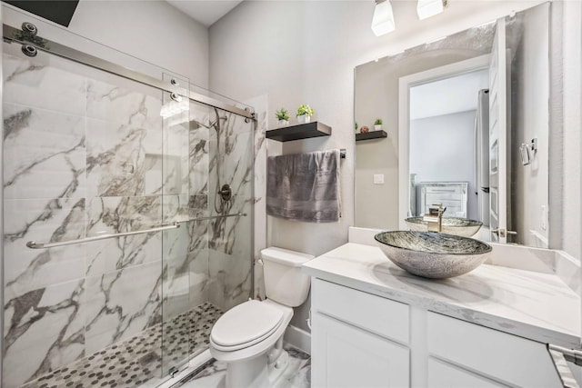 21310 Blue Wood Aster Ct, Cypress, TX 77433 - bathroom featuring vanity, toilet, and a marble finish shower