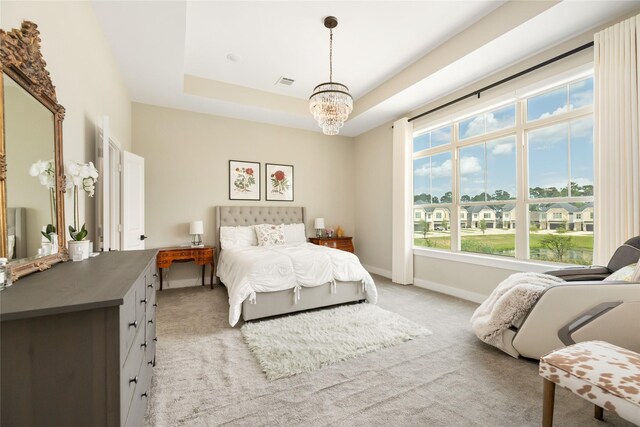 4926 Wunder Way, Houston, TX 77069 - bedroom with a chandelier, light carpet, baseboards, and a raised ceiling