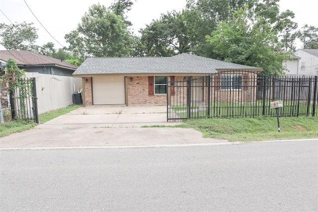 14145 Force St, Houston, TX 77015 - view of front of home featuring brick siding, an attached garage, driveway, and a fenced front yard