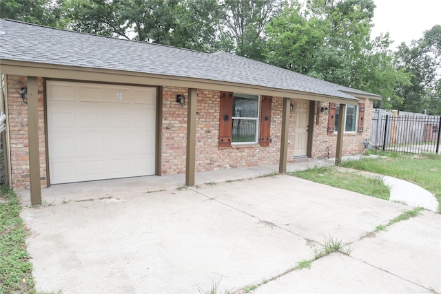 14145 Force St, Houston, TX 77015 - ranch-style house with roof with shingles, driveway, and an attached garage