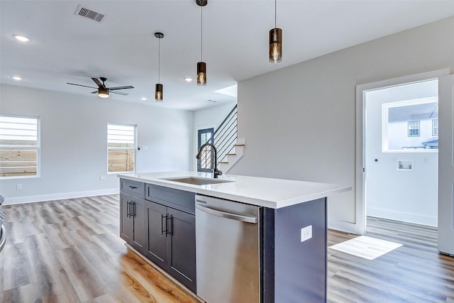 5407 Lee St, Houston, TX 77020 - kitchen featuring dishwasher, a sink, hanging light fixtures, light wood-style flooring, and recessed lighting