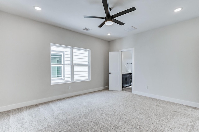 5407 Lee St, Houston, TX 77020 - unfurnished bedroom featuring light colored carpet, baseboards, recessed lighting, connected bathroom, and a ceiling fan