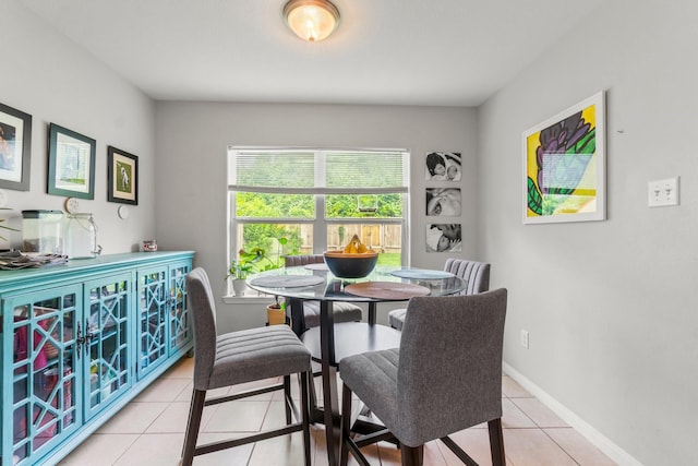 12218 Estelle Ln, Pinehurst, TX 77362 - dining area featuring light tile patterned flooring and baseboards