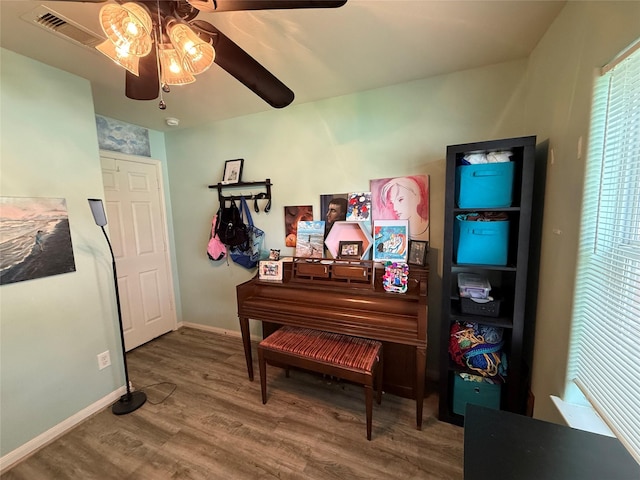 12218 Estelle Ln, Pinehurst, TX 77362 - living area with a ceiling fan, wood finished floors, and baseboards