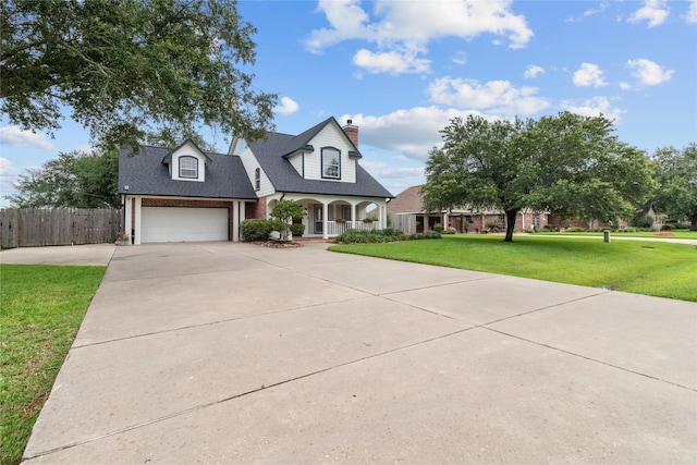 12219 W River Run Dr, Baytown, TX 77523 - traditional-style home featuring a porch, driveway, a chimney, and roof with shingles