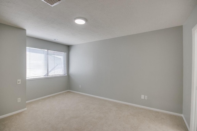 923 Cranberry Hill Ct, Houston, TX 77079 - unfurnished room with light colored carpet, a textured ceiling, and baseboards