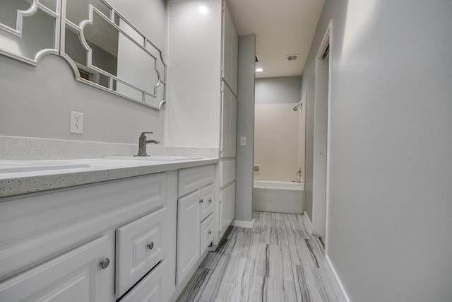 923 Cranberry Hill Ct, Houston, TX 77079 - bathroom featuring vanity, shower / washtub combination, baseboards, and recessed lighting