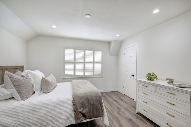 11919 Drexel Hill Dr, Houston, TX 77077 - bedroom with light wood-style floors, recessed lighting, baseboards, and vaulted ceiling