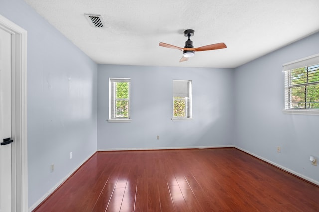 3602 Highland Lakes Dr, Kingwood, TX 77339 - unfurnished room with healthy amount of natural light, a ceiling fan, wood finished floors, and baseboards