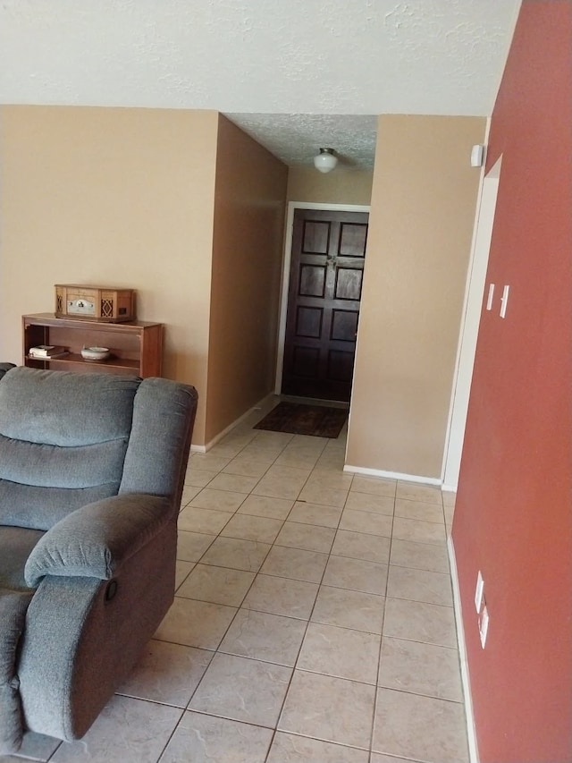 2450 Edgedale Dr, Missouri City, TX 77489 - entryway featuring light tile patterned floors and a textured ceiling