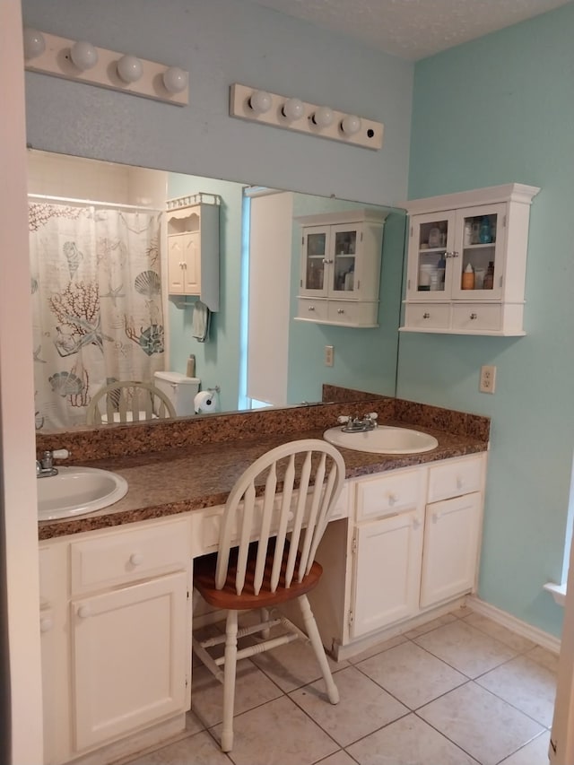 2450 Edgedale Dr, Missouri City, TX 77489 - bathroom featuring vanity, tile patterned flooring, and curtained shower