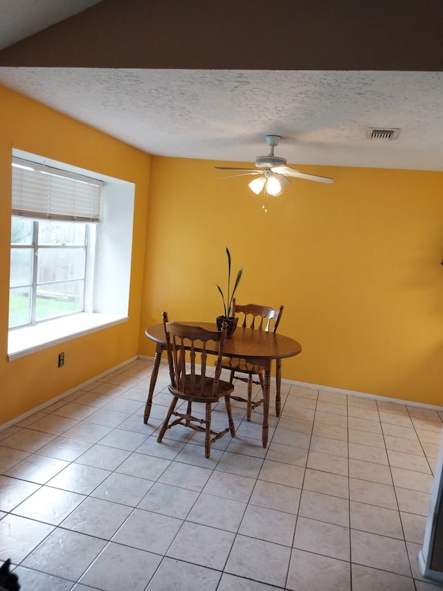 2450 Edgedale Dr, Missouri City, TX 77489 - dining area featuring a textured ceiling, light tile patterned flooring, and ceiling fan