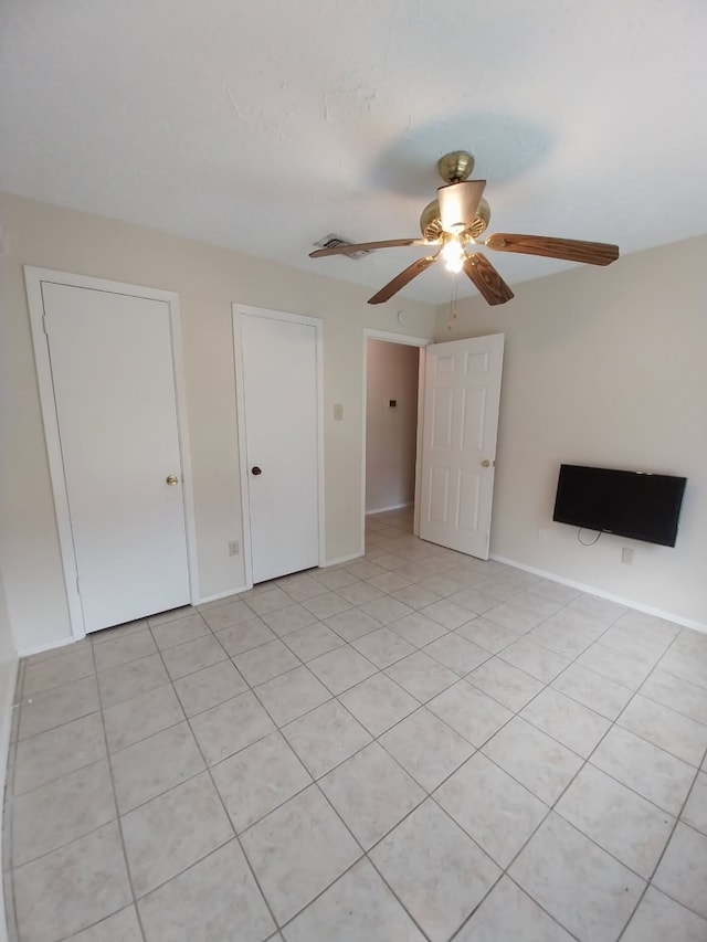 2450 Edgedale Dr, Missouri City, TX 77489 - unfurnished living room with a ceiling fan and light tile patterned floors