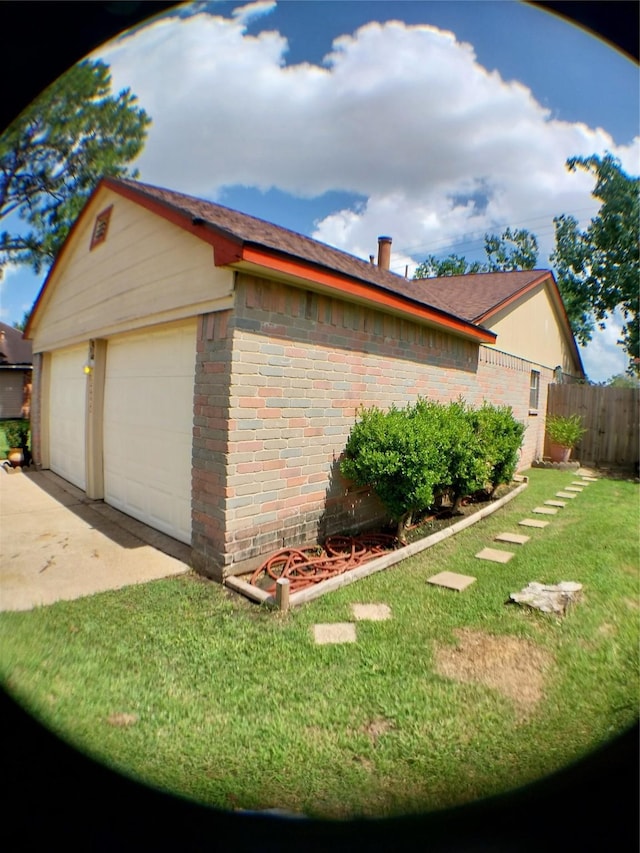 2450 Edgedale Dr, Missouri City, TX 77489 - view of home's exterior with a garage, brick siding, and an outbuilding