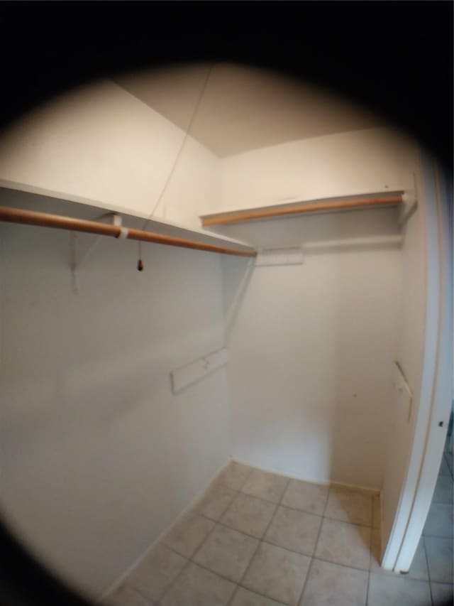 2450 Edgedale Dr, Missouri City, TX 77489 - spacious closet featuring light tile patterned floors