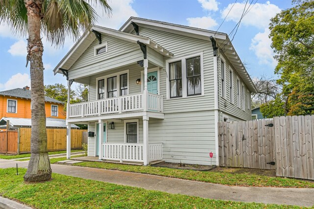 1715 30th St, Galveston, TX 77550 - view of front facade with a balcony and covered porch