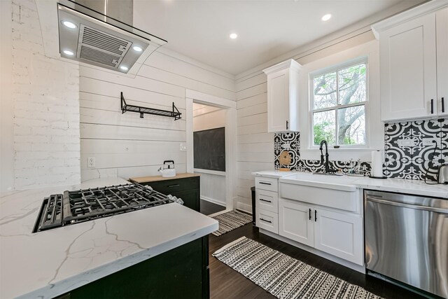 1715 30th St, Galveston, TX 77550 - kitchen featuring stainless steel dishwasher, extractor fan, a sink, white cabinets, and dark wood-style floors