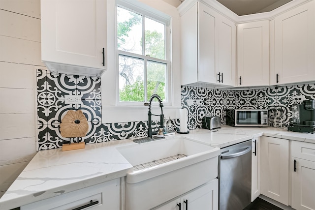 1715 30th St, Galveston, TX 77550 - kitchen featuring appliances with stainless steel finishes and white cabinetry